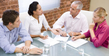 HOA Board Members reviewing papers