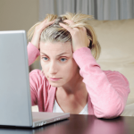 frustrated woman at laptop